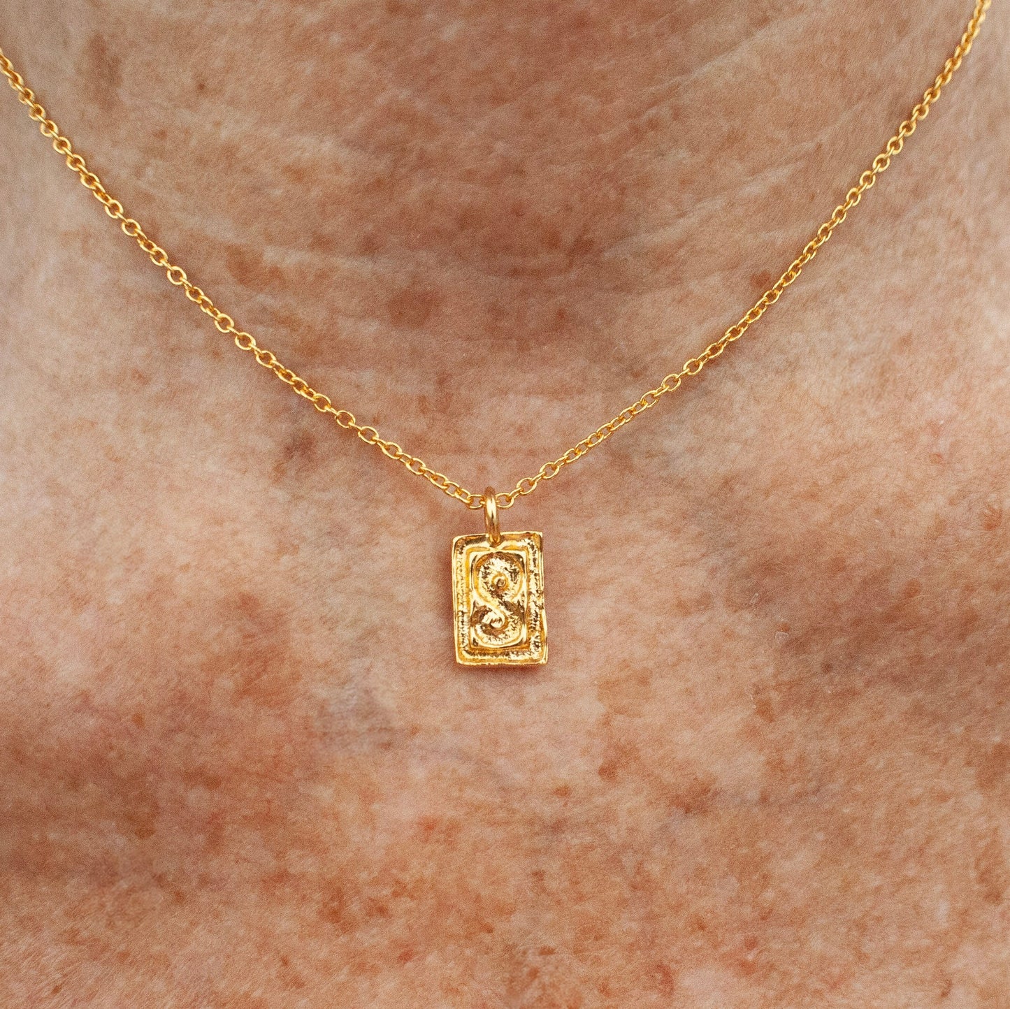 Golden S Amulet